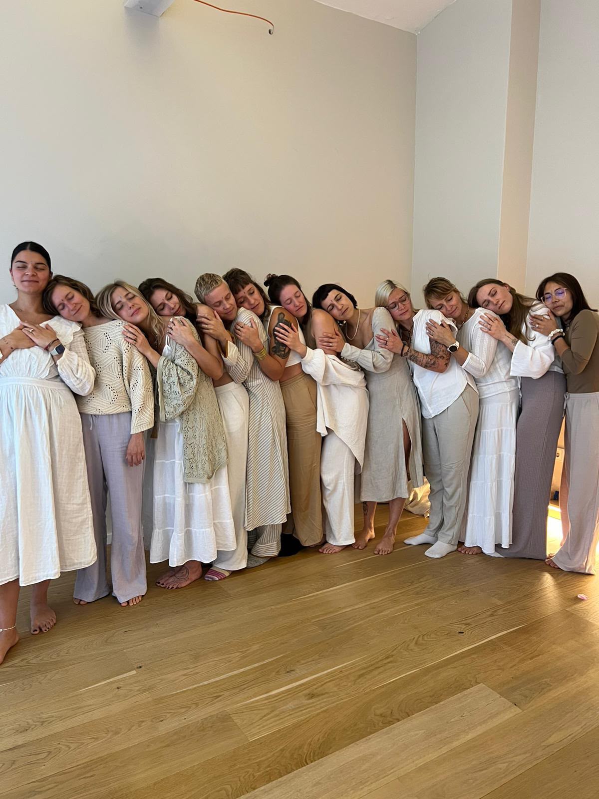 Participants holding each other after a session