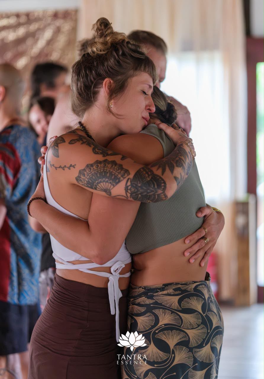 Pauli embracing a participant at a retreat