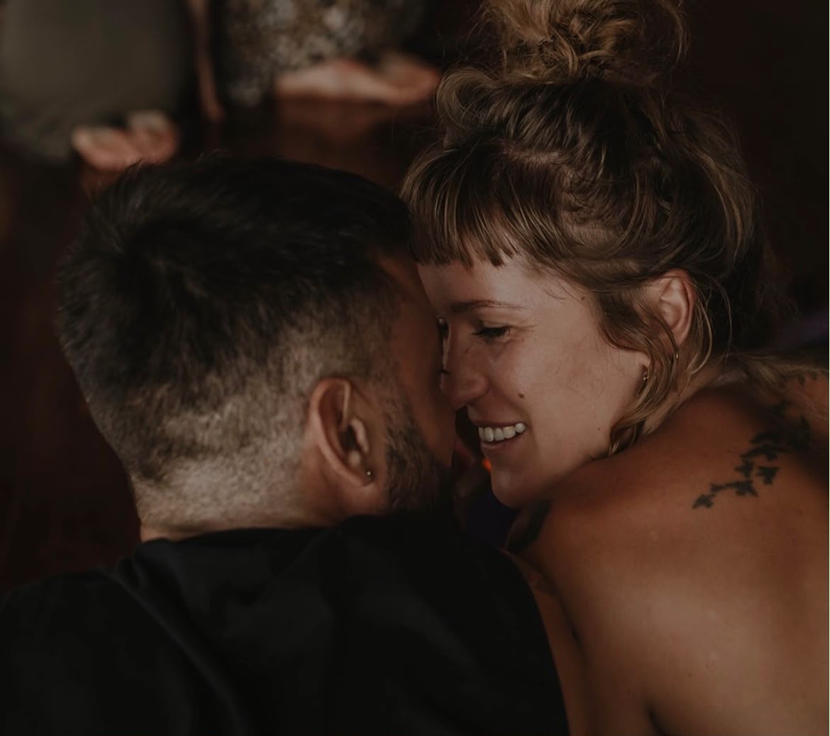 An intimate moment between two participants during a session